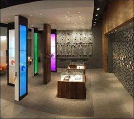 AT&T concept store interior with screens and product wall